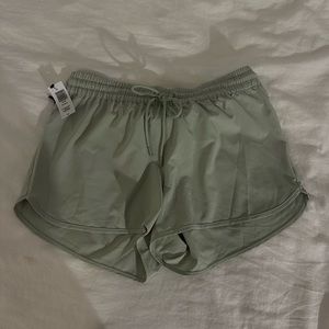 TNA SAGE GREEN WORKOUT SHORTS SIZE S